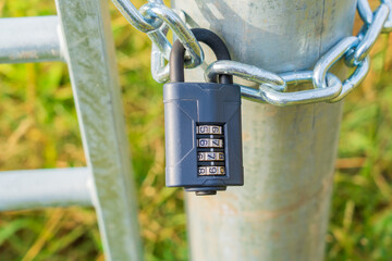Security combination padlock on a gate, secure protected property, Security Concept