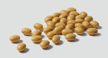 Pile of soybeans on a white surface with soft shadows.