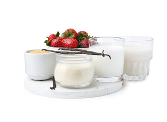 Different ingredients for panna cotta. Milk, sugar, vanilla and strawberries isolated on white