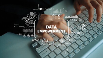 Hands Typing on Keyboard with Overlay of Data Empowerment Graphics and Infographics in Modern...