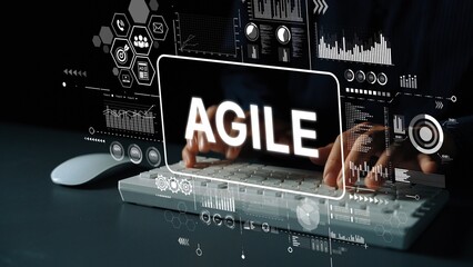 Modern Agile Methodology Concept with Hands on Keyboard and Digital Graphics Overlay. Asymptotic smart data analytic.