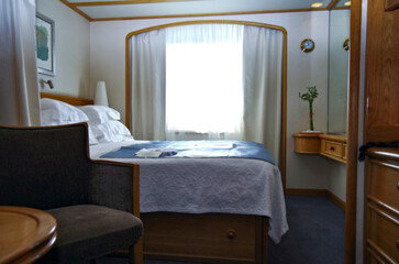 Luxurious suite stateroom cabin room onboard luxury cruise ship cruiseship yacht liner with bedroom...