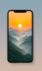 Sunrise over misty mountains displayed on mobile phone screen at dawn