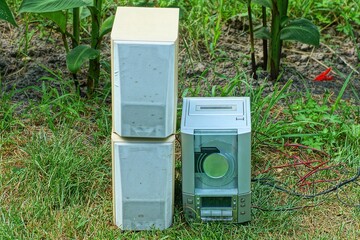 one small electric gray plastic electric old with buttons cassette player with powerful wooden...