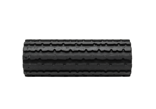 Cylindrical ridged dark gray foam roller against a black backdrop