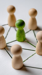 Obraz premium Green figure connecting wooden figures in a network connection teamwork