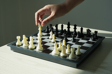 Close up shot hand of asian business person moving chess at office for training to defeat enemy...