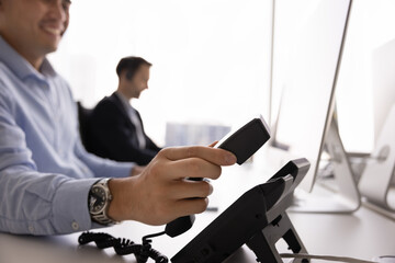 Business communication, customer services and technical support provided via phone. Close up view...