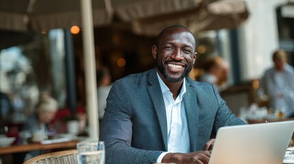 Portrait of a smiling black businessman with laptop at cafe. AI Generated