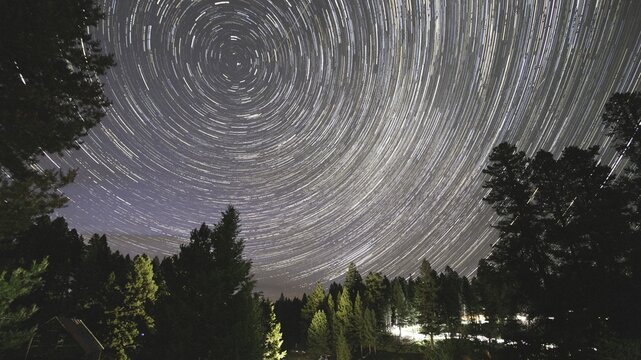 Long exposure image of star trails in the night sky at Garnet Ghost Town in Montana, U.S.A., photographed in the evening .