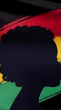 A vibrant Juneteenth celebration scene featuring African American flags in red, black, and green. Vertical 916