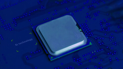 Close-up of a plain silver CPU chip mounted on a clean blue circuit board, symbolizing digital...