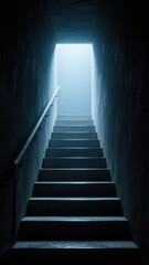 Fototapeta premium A dimly lit staircase leading to a bright exit.