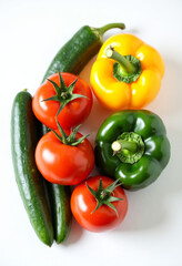 Bell Peppers and Tomatoes on White Surface