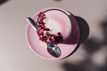 Rose Latte with teamed milk, rose
syrup, beetroot powder and dried rose petals. Aesthetic pink preppy style