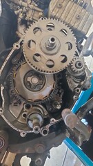 Close-up view of the intricate internal gears and components of a vehicle engine, showcasing precision engineering and mechanical complexity. Ideal for automotive, repair, or technology themes.