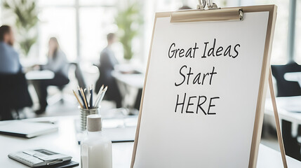 Brainstorming Session: A sign that says "Great Ideas Start HERE" in a bright office during a meeting, promoting creativity and collaboration.