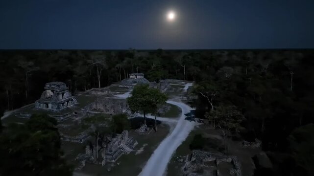 Under the glow of the moon, the ancient mayan ruins of cahal pech stand as silent witnesses to a rich history amidst the dense jungle of belize