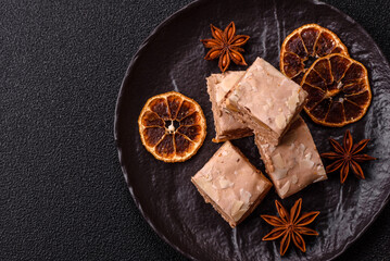 Nougat or white caramel with hazelnuts and pistachios and citrus pieces. White nougat with nuts