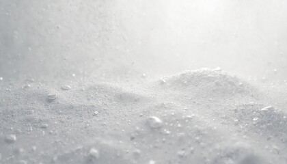 Abstract white grainy texture with subtle light effects and copy space for text. Rough monochrome backdrop resembles sand surface or fine dust particles, suitable for design elements.