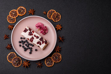 Nougat or white caramel with hazelnuts and pistachios and citrus pieces. White nougat with nuts