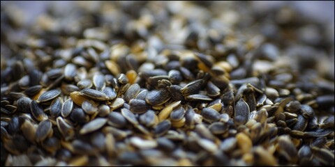 Obraz premium An eye-level close-up of sunflower seeds, perfect for culinary uses.