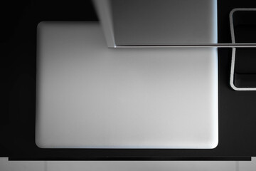 Cozy Home Office with Laptop and Open Notebook on Clean Desk