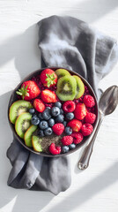 Colorful Healthy Breakfast Bowl Topped with Fresh Fruits and Seeds