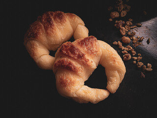 croissant in a golden crescent shape with a black background