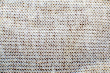 Light coarse linen fabric texture with visible thread weave creating natural background
