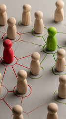 Obraz premium Network of Wooden Peg People Connected by Red and Green Lines One Red Peg Person One Green Peg Person Multiple Beige Peg People