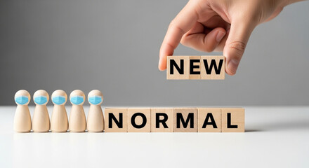 Disruptive change in the new normal era: Face-masked wooden doll with ‘NEW NORMAL’ blocks, post-COVID-19