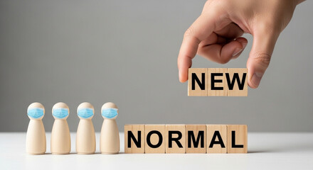 Post-pandemic innovation concept – Wooden figure in face mask with 'NEW NORMAL' letters symbolizing change