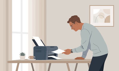 Man Printing Documents at Home Office Desk