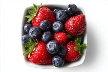 Obraz premium Bowl filled with fresh strawberries and blueberries displaying vibrant colors against a clean white background ideal for healthy eating inspiration and summer recipes