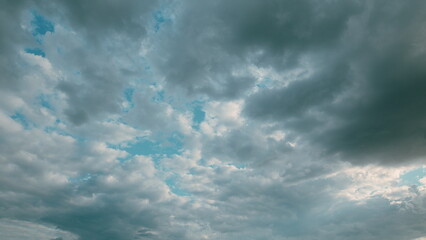 Dramatic Cloudy Skies with Beautiful Light Blue Patches, a Truly Captivating Sight