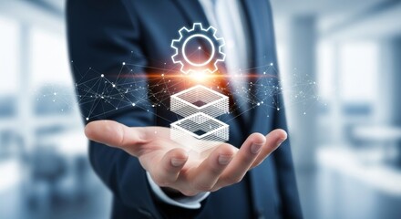Businessman holding a digital interface with gears and data blocks representing business technology