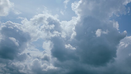 Witness the Dramatic and Beautiful Cloud Patterns that Grace a Clear Blue Sky Above Us