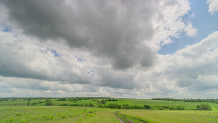 Obraz premium A Beautiful Overcast Landscape Featuring Lush Green Fields That Captivates and Inspires