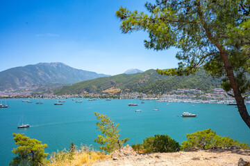 Fototapeta premium Boncuk Bay, Blue Lagoon and Oludeniz beach aerial panoramic view. Oludeniz is a beach resort in the Fethiye district of Mugla Province, Turkey.