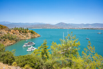 Naklejka premium Boncuk Bay, Blue Lagoon and Oludeniz beach aerial panoramic view. Oludeniz is a beach resort in the Fethiye district of Mugla Province, Turkey.