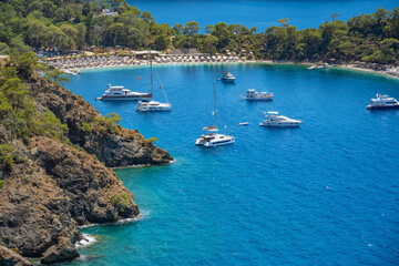 Obraz premium Boncuk Bay, Blue Lagoon and Oludeniz beach aerial panoramic view. Oludeniz is a beach resort in the Fethiye district of Mugla Province, Turkey.