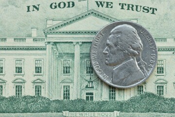American cent coin on dollar bill close up. United States currency