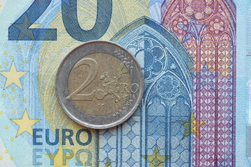 European currency euro cent coin lies on euro banknote bill