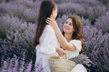 Mother and daughter enjoying time together in lavender field