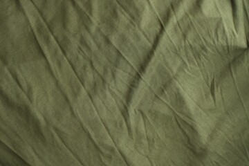 Background texture of camouflage khaki green color military uniform fabric