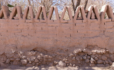 Adobe Wall with Triangular Decorative Elements in San Pedro de Atacama Chile