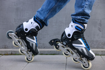 Man roller skating on city street, closeup