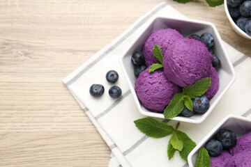 Tasty sorbet with blueberries and mint on wooden table, flat lay. Space for text