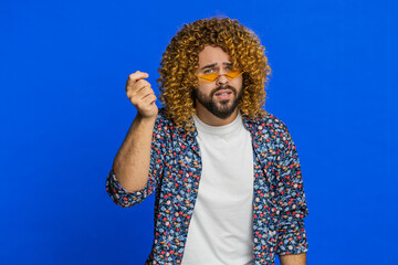Knock-knock who is there. Confused excited man with curly hairstyle wig knocking door gesture...